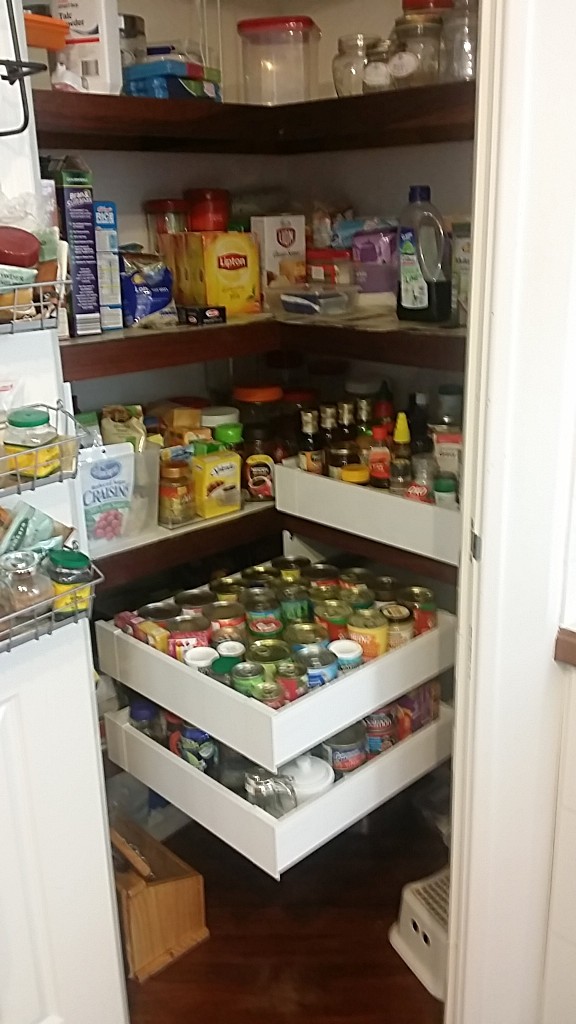 Image of walk in corner pantry with 3 pantry drawers for cans and bottles supplied and installed by Easy Access Kitchens